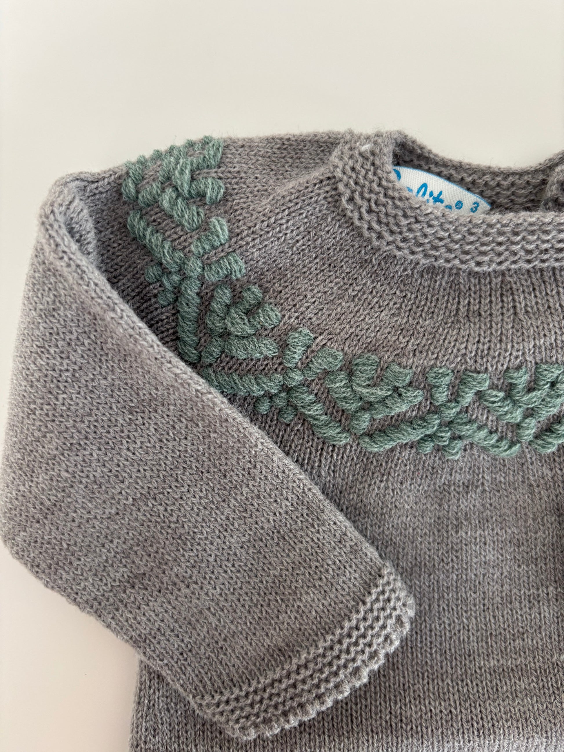 Pelele detalles verdes